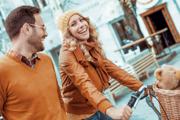 istock Happy young couple going for a bike ride 655167630