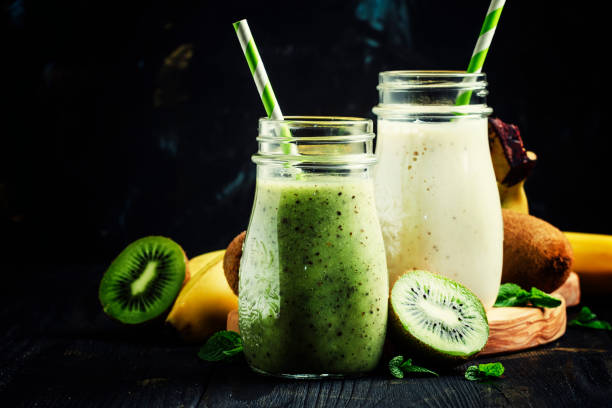 istock Kiwi and banana smoothies in bottles 655173566
