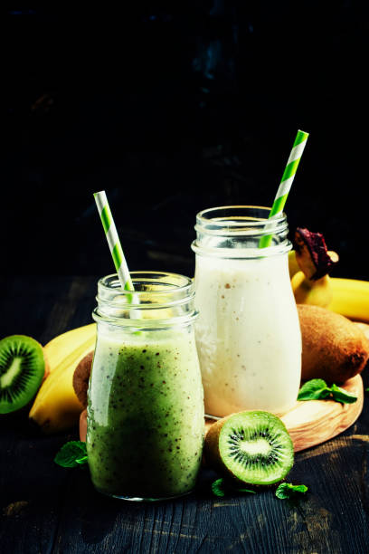 istock Kiwi and banana smoothies in bottles 655173596