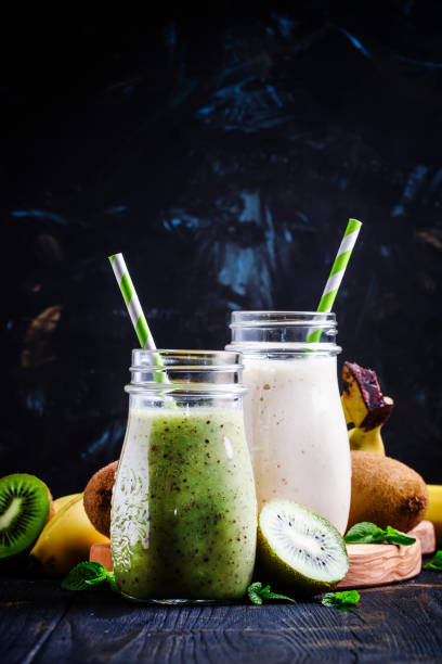istock Kiwi and banana smoothies in bottles 655173742
