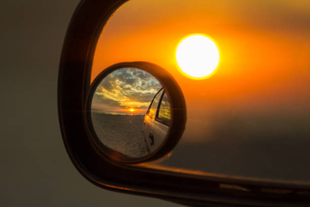 istock Sunrise in left side view mirror driver POV Close up 655182348