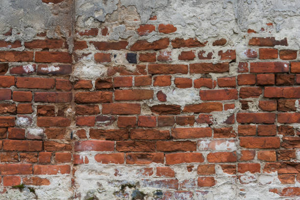 istock Fragment of old brick wall with multicolored bricks and tones, background 655190312