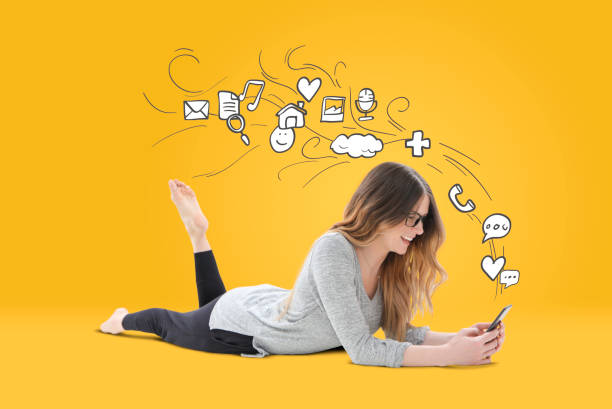 istock Woman relaxed using phone with icons 655202606