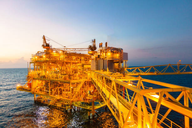 istock Offshore construction platform for production oil and gas with bridge in evening time 655205564