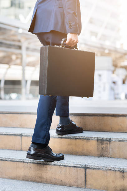 istock Businessman walking upward on the stair 655228998
