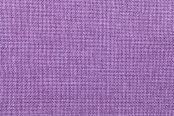 light purple background from a textile material. fabric with natural texture. backdrop. - burlap textured textured effect textile imagens e fotografias de stock