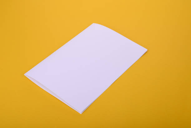 istock white paper bifold brochure mockup on yellow background 655254058