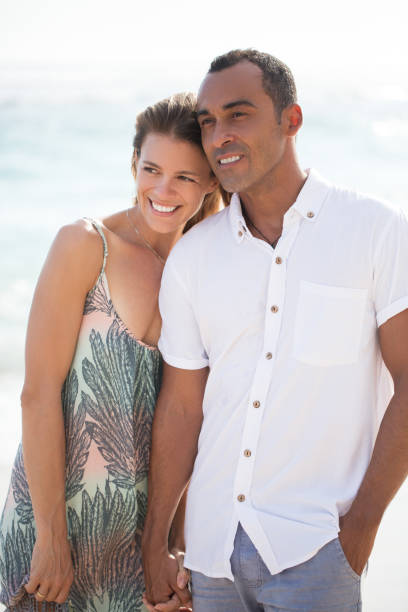 istock Dreamful couple holding hands at sea 655260166