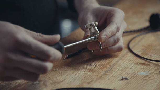 istock Electricians spins the screws using a screwdriver on the retro-plug 655263032