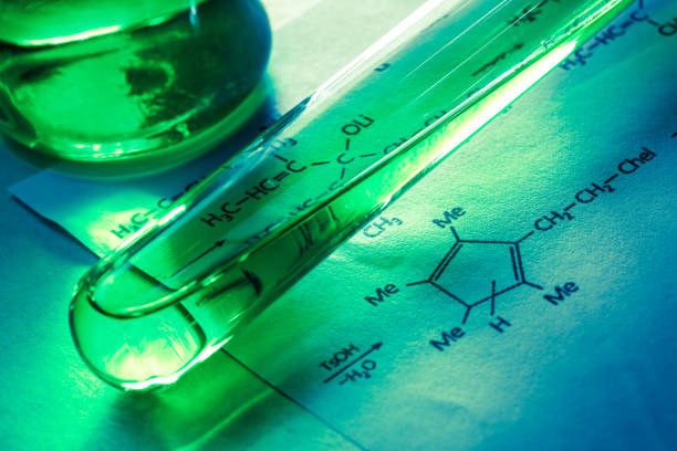 istock Chemical tubes with reaction formula 655263474