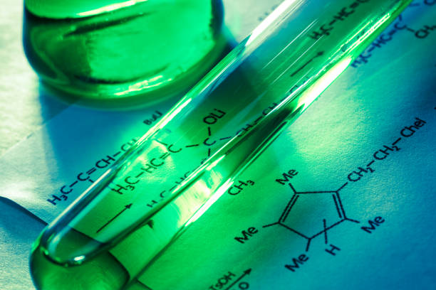 istock Chemical tubes with reaction formula 655265992