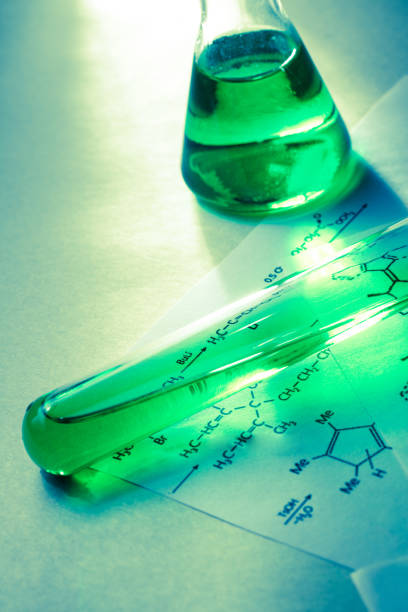 istock Chemical tubes with reaction formula 655266358