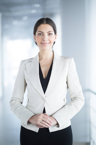 istock Smiling Elegant Business Woman in Office Hall 655268568