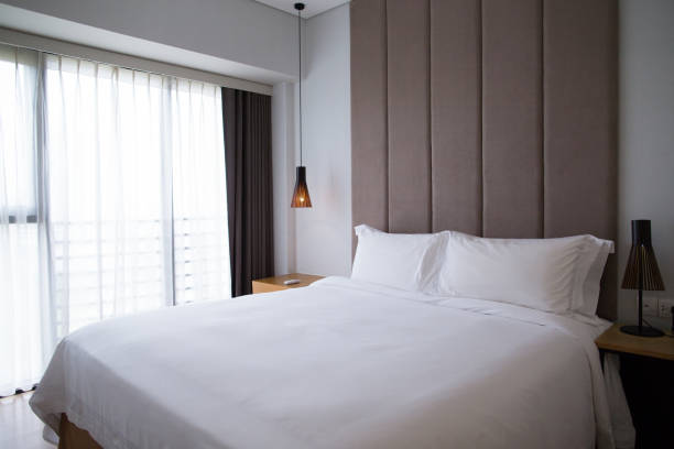 istock Hotel bedroom interior with bed and nightlight 655271752