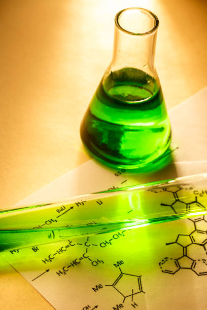 istock Chemical tubes with reaction formula 655272676