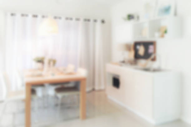 istock Defocus wooden dining table next to pantry in modern kitchen 655278112