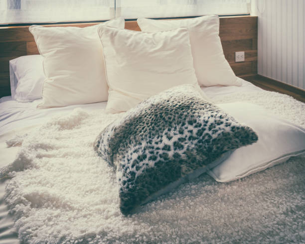 istock stylish bedroom interior with black and white pillows on bed- vintage style effect 655280584