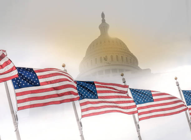 istock United States flags with Capitol building. 655282200