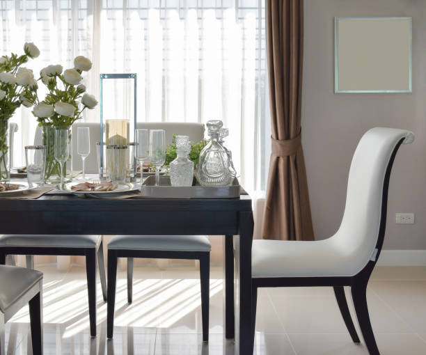 istock dining wooden table and comfortable chairs in modern home with elegant table setting 655290896