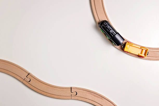 istock Toy train and wooden rails on white background. Top view. Copy space for text 655307520