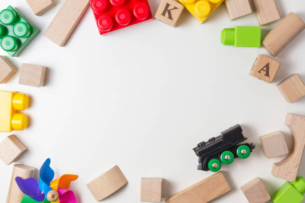 istock Colorful kids toys on white background as frame with copy space for text. Flat lay. Top view 655307600