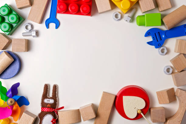 istock Kids toys on white background as bord frame with copy space for text. Top view. Flat lay 655307672