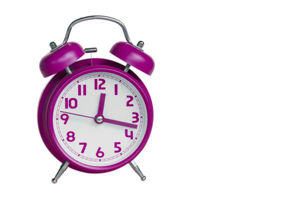 istock pink retro alarm clock on white background 655308054