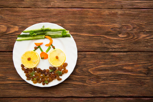 istock Fresh organic vegetables and fruits on dish over rustic background, top view, place for text. Healthy lifestyle concept - vegetable bike on dish on wooden. 655310626