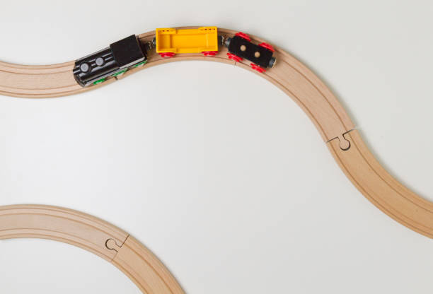 istock Toy train and wooden rails on white background. Top view. Copy space for text 655317126