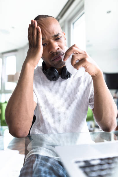 istock man with flu and cold at home 655322130