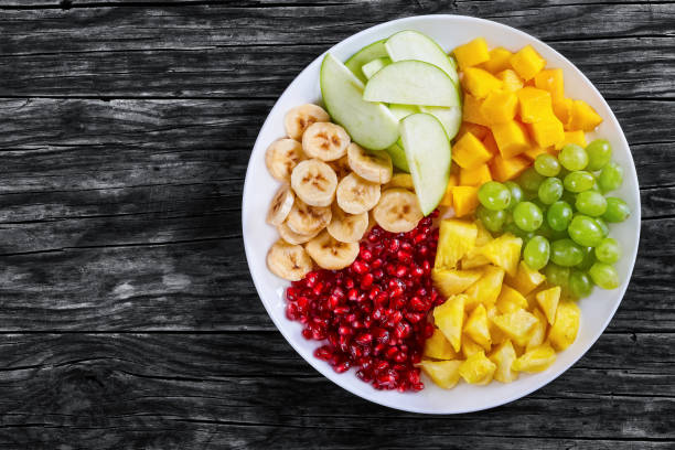 istock delicious colorful fruit cut in slices 655327636