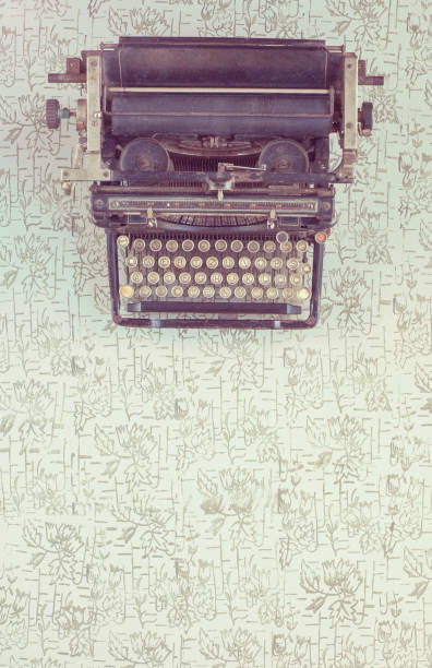 istock Old typewriter on vintage wooden background 655327792