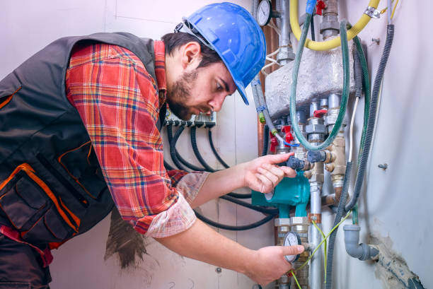 Technician installing heating system Technician installing heating system heating engineer stock pictures, royalty-free photos & images
