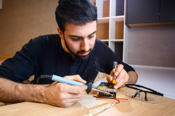 istock Electrician soldering wires 655328590