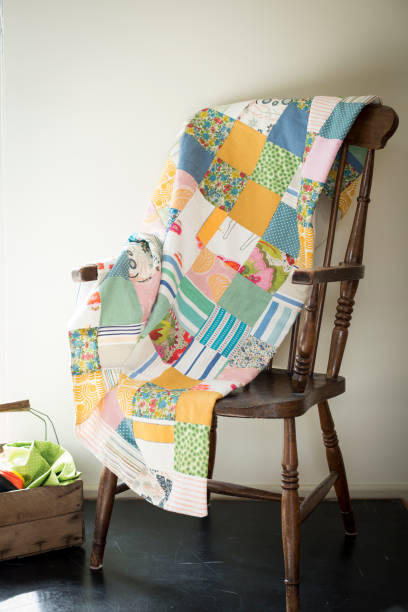 istock Multicolored Patchwork Blanket on an Antique Wooden Chair 655330810
