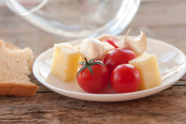 Tomatoes stuffed with cheese, beautifully decorated, served with cheese, diced and sliced​​.