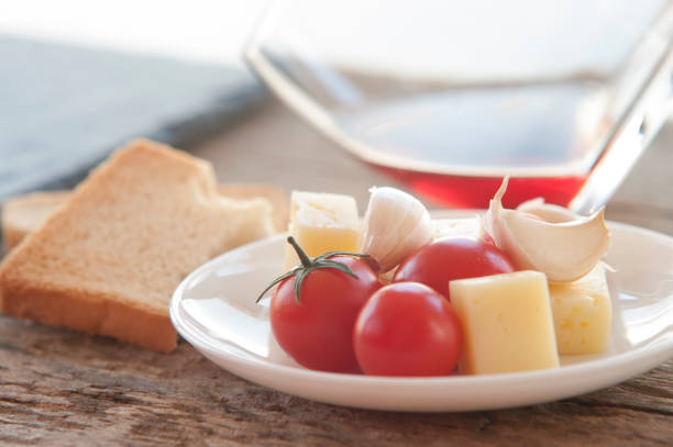 Tomato and melted cheese bruschetta and red wine