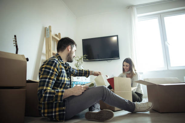 istock Young couple moving to a new house 655342642