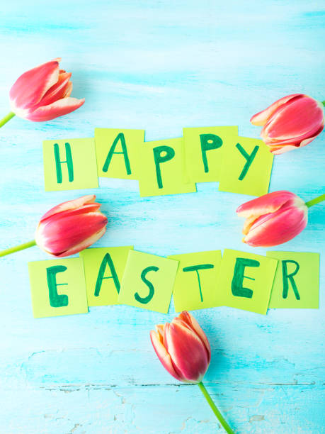 istock Happy Easter background tulips flowers hand written letters 655367766