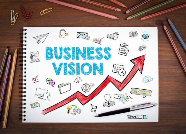 istock Business Vision Concept. Notebooks, pen and colored pencils on a wooden table. 655371690