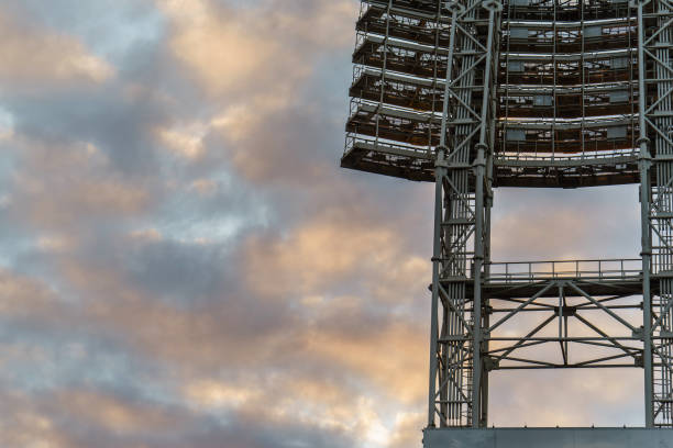 istock the floodlights at the stadium against the sky with clouds 655374190