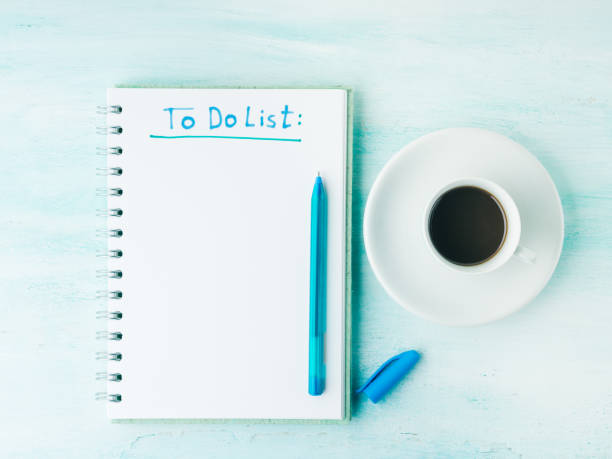 istock To do list page flat lay and cup of coffee background 655377088