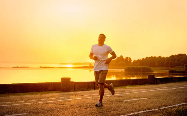 istock Youngathlete on the evening run of sunset. 655377524