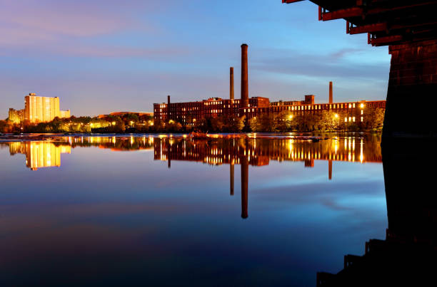 istock Lowell Mills Reflecting on the Merrimack River 655391086