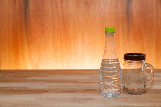 istock bottled water on wood terrace and light wooden interior. 655397772