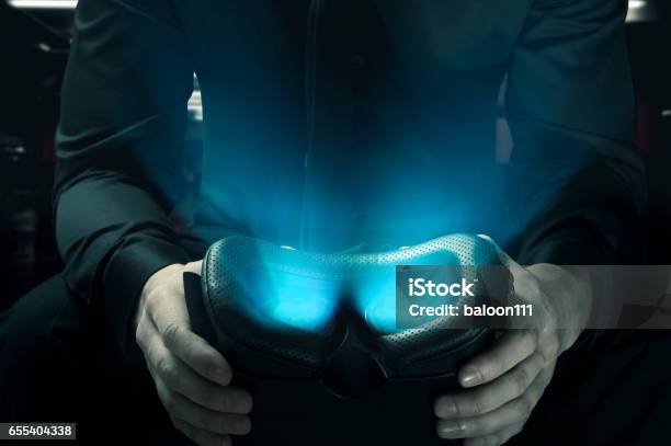 The Dark Side Of Virtual Reality Man Holds Glowing Vr Googles Stock Photo - Download Image Now
