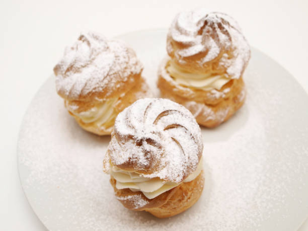 istock Choux pastry buns, filled with whipped cream 655411248