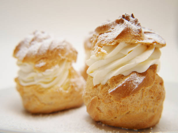 istock Choux pastry buns, filled with whipped cream 655411288