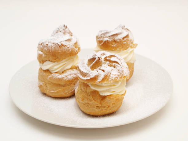 istock Choux pastry buns, filled with whipped cream 655411356