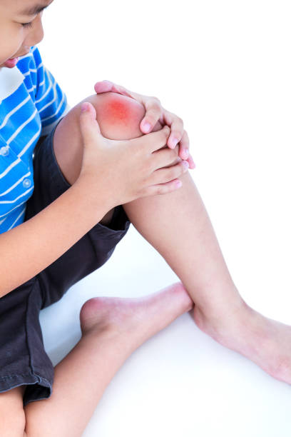 istock Asian child injured at knee. Isolated on white background. 655418324